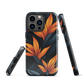 Phone case with bold orange bird of paradise flowers on dark background.