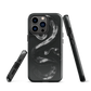 Phone case with detailed black python design on dark background.