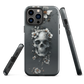 Gothic phone case with a floral skull design in grey tones, featuring white blossoms and dark detailing.