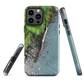 Resting Place phone case with aerial artwork of river rocks, green bush, and driftwood in a New Zealand stream.