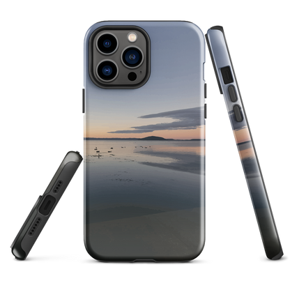 Phone case with tranquil lake scene at sunrise and distant hills.