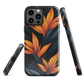 Phone case with bold orange bird of paradise flowers on dark background.