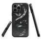 Phone case with detailed black python design on dark background.