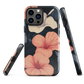 Phone case with coral hibiscus flowers and ivory blooms on dark background