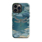 Nature-inspired phone case featuring a dragonfly over calm water with blue and green forest tones.