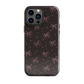 Midnight Bow seamless repeat pattern — pink hand-drawn ribbon bows and sparkle stars on a black background