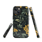 NZ Kowhai phone case with native yellow floral and green leaves on black background by designer Ben Hart.