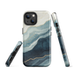 An elegant abstract phone case inspired by layered coastal forms in blue and teal tones.
