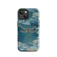 Nature-inspired phone case featuring a dragonfly over calm water with blue and green forest tones.