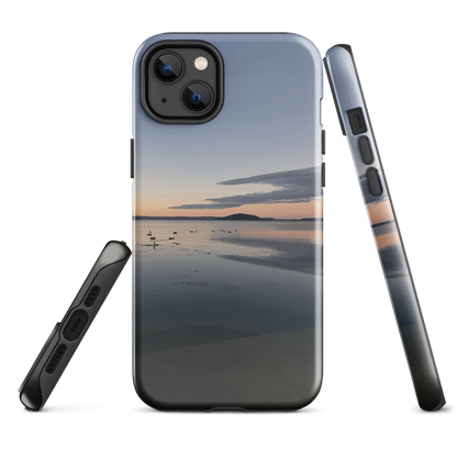 Phone case with tranquil lake scene at sunrise and distant hills.