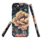 Phone case with vintage-style pink roses and bees on dark background, floral New Zealand artwork.