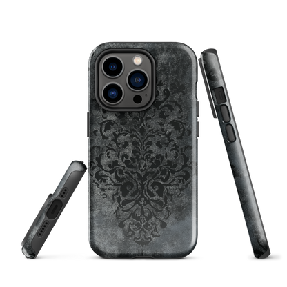 Dark damask patterned phone case with a vintage gothic aesthetic and textured stone background.
