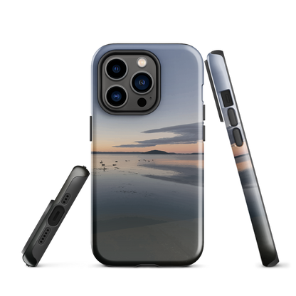 Phone case with tranquil lake scene at sunrise and distant hills.