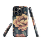 Phone case with vintage-style pink roses and bees on dark background, floral New Zealand artwork.