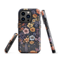 Phone case with colourful wildflowers on dark background, floral art design