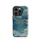 Nature-inspired phone case featuring a dragonfly over calm water with blue and green forest tones.