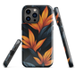 Phone case with bold orange bird of paradise flowers on dark background.