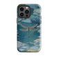 Nature-inspired phone case featuring a dragonfly over calm water with blue and green forest tones.