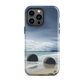 Moeraki Boulders coastal designer phone case with ocean waves and dramatic NZ sky