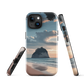 Phone case with Cathedral Cove beach and sunset scene, featuring soft skies and sea stack