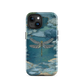 Nature-inspired phone case featuring a dragonfly over calm water with blue and green forest tones.