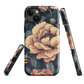 Phone case with vintage-style pink roses and bees on dark background, floral New Zealand artwork.