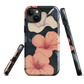 Phone case with coral hibiscus flowers and ivory blooms on dark background