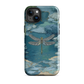 Nature-inspired phone case featuring a dragonfly over calm water with blue and green forest tones.