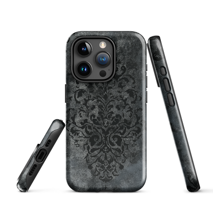 Dark damask patterned phone case with a vintage gothic aesthetic and textured stone background.