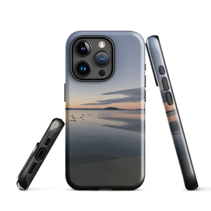 Phone case with tranquil lake scene at sunrise and distant hills.