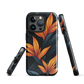 Phone case with bold orange bird of paradise flowers on dark background.