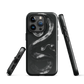 Phone case with detailed black python design on dark background.