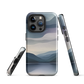 Phone case with moody blue and purple layered mountain and lake landscape artwork