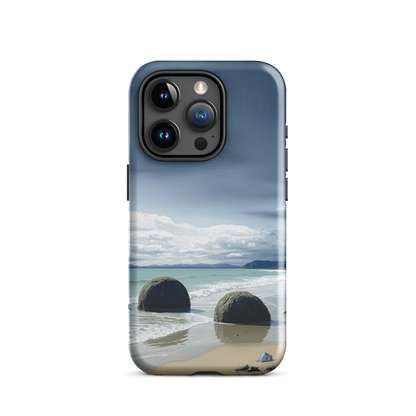 Moeraki Boulders coastal designer phone case with ocean waves and dramatic NZ sky