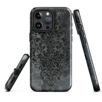 Dark damask patterned phone case with a vintage gothic aesthetic and textured stone background.