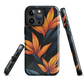 Phone case with bold orange bird of paradise flowers on dark background.
