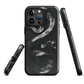 Phone case with detailed black python design on dark background.