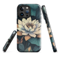 Phone case with ivory water lily, green leaves, and butterfly accents on dark background