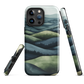 Phone case with layered mountain and forest landscape in blue and green hues