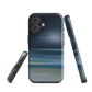 Dark abstract phone case with blue and grey streaks and glossy finish.