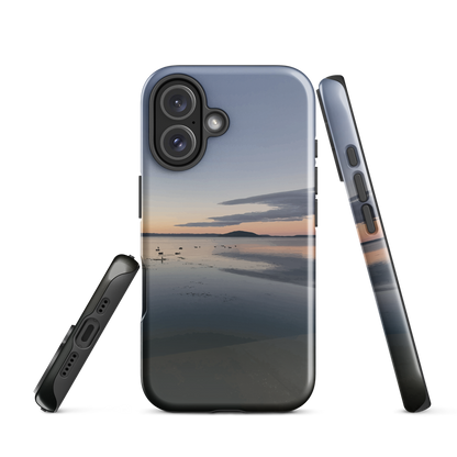 Phone case with tranquil lake scene at sunrise and distant hills.