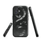 Phone case with detailed black python design on dark background.