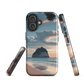 Phone case with Cathedral Cove beach and sunset scene, featuring soft skies and sea stack