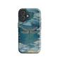 Nature-inspired phone case featuring a dragonfly over calm water with blue and green forest tones.