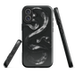 Phone case with detailed black python design on dark background.