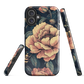 Phone case with vintage-style pink roses and bees on dark background, floral New Zealand artwork.