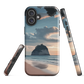 Phone case with Cathedral Cove beach and sunset scene, featuring soft skies and sea stack