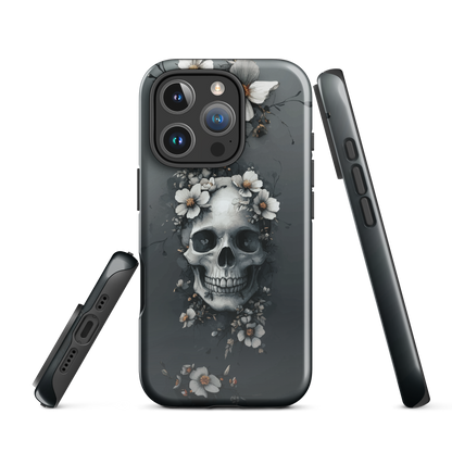 Gothic phone case with a floral skull design in grey tones, featuring white blossoms and dark detailing.