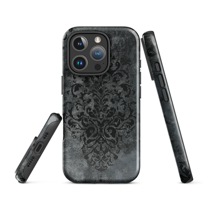 Dark damask patterned phone case with a vintage gothic aesthetic and textured stone background.