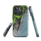 Resting Place phone case with aerial artwork of river rocks, green bush, and driftwood in a New Zealand stream.